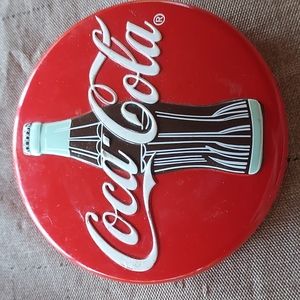 Coca cola paperweight.